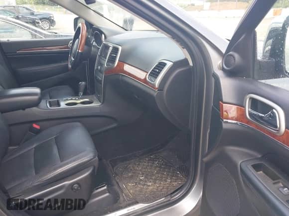 2012 Jeep Grand Cherokee Limited z VIN 1C4RJEBGXCC290696, wystawiony jako IAAI lot #42753634 z przebiegiem 205 808 mil mil oraz . Historia ofert i sprzedaży dostępna na DreamBid. Obrazek 5.