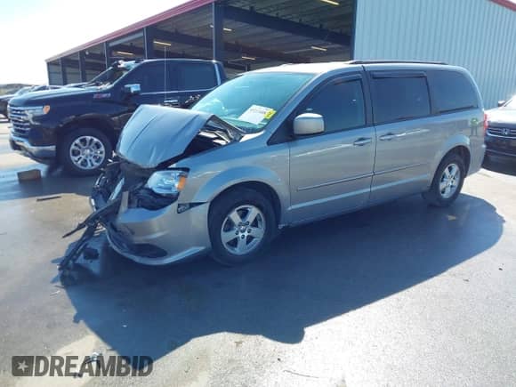 2013 Dodge Grand Caravan SXT with VIN 2C4RDGCG9DR636716, listed as a IAAI auction lot 43213408 with 160,918 mi miles and . Bid and sale history available at DreamBid. Image 2.