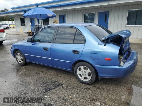 2002 Hyundai Accent GL z VIN KMHCG45C52U288494, wystawiony jako Copart lot #64835465 z przebiegiem 124 538 mil mil oraz Szkoda całkowita • Salvage title. Historia ofert i sprzedaży dostępna na DreamBid. Obrazek 2.