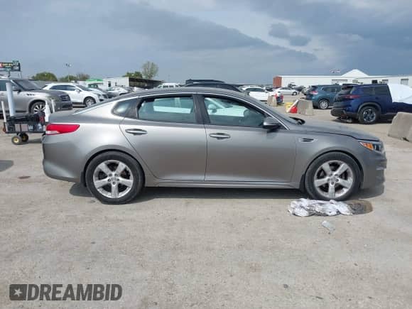 2016 Kia Optima EX with VIN 5XXGU4L34GG059142, listed as a IAAI auction lot 43519874 with 141,445 mi miles and . Bid and sale history available at DreamBid. Image 13.