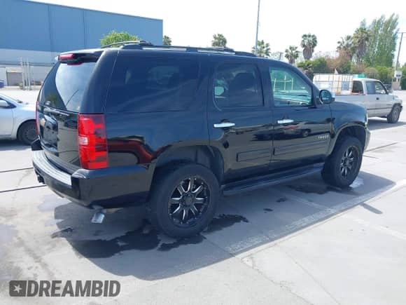 2013 Chevrolet Tahoe LS with VIN 1GNSKAE07DR355208, listed as a IAAI auction lot 42095090 with 159,409 mi miles and . Bid and sale history available at DreamBid. Image 4.