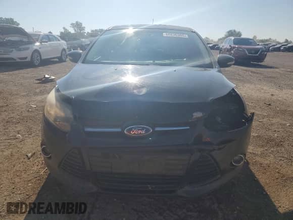 2014 Ford Focus Titanium z VIN 1FADP3N2XEL269840, wystawiony jako Copart lot #68636305 z przebiegiem 143 338 mil mil oraz Szkoda całkowita • Salvage title. Historia ofert i sprzedaży dostępna na DreamBid. Obrazek 5.