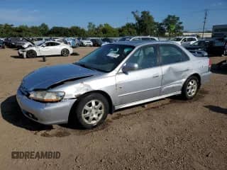 2002 Honda Accord EX with VIN 1HGCG56692A038763, listed as a Copart auction lot 71771595 with 158,801 mi miles and Salvage title. Bid and sale history available at DreamBid. Image 1.