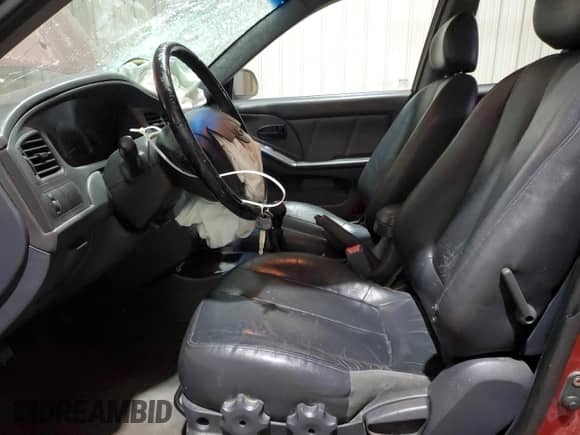 2003 Hyundai Elantra GT z VIN KMHDN55D23U082415, wystawiony jako Copart lot #45854355 z przebiegiem 165 657 mil mil oraz Szkoda całkowita • Salvage title. Historia ofert i sprzedaży dostępna na DreamBid. Obrazek 7.