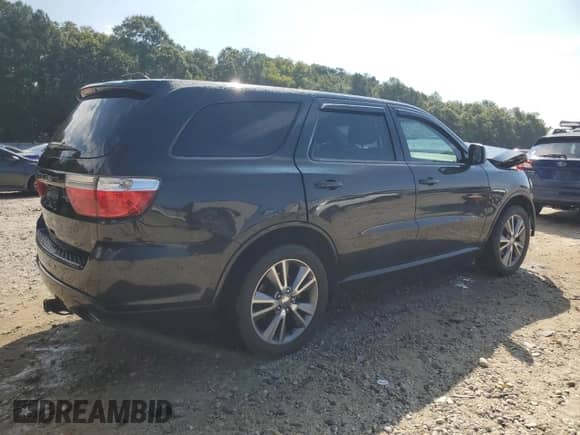 2013 Dodge Durango SXT with VIN 1C4RDHAG4DC662092, listed as a Copart auction lot 71425135 with 169,603 mi miles and Salvage title. Bid and sale history available at DreamBid. Image 3.