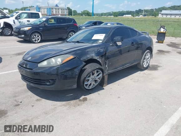 2007 Hyundai Tiburon GT с VIN KMHHN66F17U261929, выставлен на аукционе IAAI как лот 42679006 с пробегом 100 213 миль миль и . История ставок и продаж доступна на DreamBid. Изображение 2.