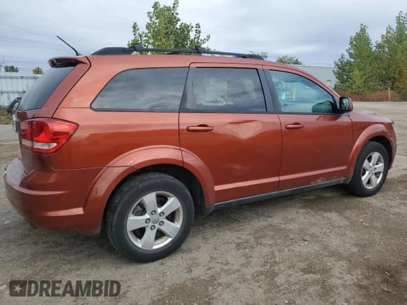 2013 Dodge Journey American Value with VIN 3C4PDCABXDT504116, listed as a Copart auction lot 82558635 with 283,086 mi miles and Clean title. Bid and sale history available at DreamBid. Image 3.