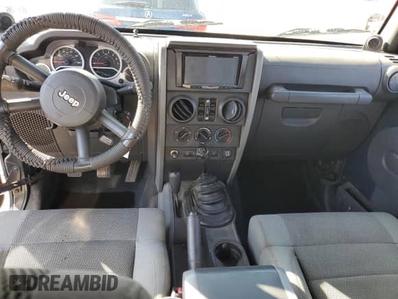 2007 Jeep Wrangler Unlimited Rubicon with VIN 1J4GA69167L154709, listed as a Copart auction lot 87370255 with 151,871 mi miles and Salvage title. Bid and sale history available at DreamBid. Image 8.