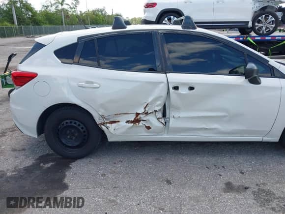 2018 Subaru Impreza with VIN 4S3GTAA65J3701017, listed as a IAAI auction lot 42827533 with 109,708 mi miles and . Bid and sale history available at DreamBid. Image 6.