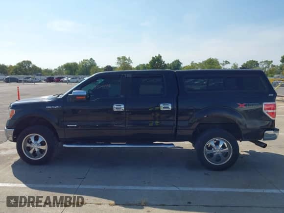 2013 Ford F-150 Lariat with VIN 1FTFW1ET3DKE67750, listed as a IAAI auction lot 43240995 with 159,269 mi miles and . Bid and sale history available at DreamBid. Image 14.