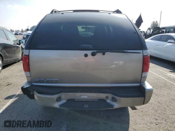 2005 Chevrolet Blazer z VIN 1GNCS18X95K107274, wystawiony jako Copart lot #89013455 z przebiegiem 98 047 mil mil oraz Szkoda całkowita • Salvage title. Historia ofert i sprzedaży dostępna na DreamBid. Obrazek 6.