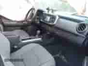 2018 Toyota Tacoma SR with VIN 5TFRX5GN8JX117075, listed as a IAAI auction lot 41723001 with 67,559 mi miles and . Bid and sale history available at DreamBid. Image 5.