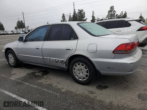2001 Honda Accord LX z VIN 1HGCG65581A039335, wystawiony jako Copart lot #44390165 z przebiegiem 207 039 mil mil oraz Szkoda całkowita • Salvage title. Historia ofert i sprzedaży dostępna na DreamBid. Obrazek 2.