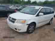 2010 Dodge Grand Caravan SXT with VIN 2D4RN5D16AR342815, listed as a IAAI auction lot 43043040 with 302,074 mi miles and . Bid and sale history available at DreamBid. Image 2.