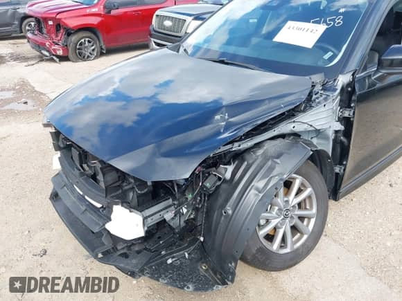 2025 Mazda CX-5 S Preferred z VIN JM3KFBCL5S0695658, wystawiony jako IAAI lot #43301142 z przebiegiem Nie podano mil oraz . Historia ofert i sprzedaży dostępna na DreamBid. Obrazek 6.