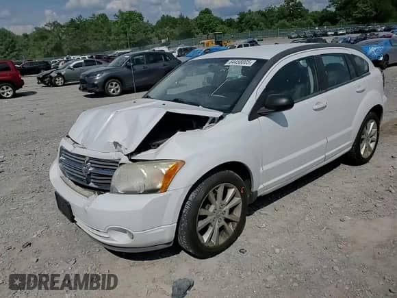 2011 Dodge Caliber Heat with VIN 1B3CB5HA9BD214435, listed as a Copart auction lot 64458005 with 138,749 mi miles and Salvage title. Bid and sale history available at DreamBid. Image 14.