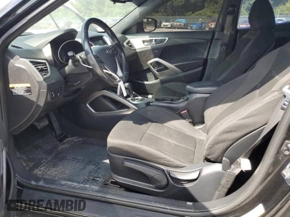 2017 Hyundai Veloster с VIN KMHTC6AD1HU321280, выставлен на аукционе Copart как лот 65746405 с пробегом 59 139 миль миль и Списание • Salvage title. История ставок и продаж доступна на DreamBid. Изображение 7.