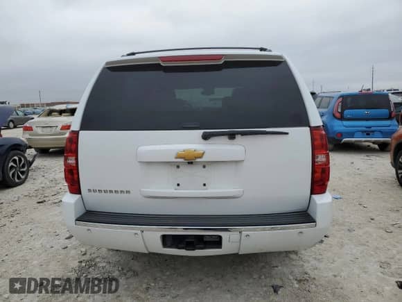 2014 Chevrolet Suburban LTZ with VIN 1GNSCKE0XER132827, listed as a Copart auction lot 84580974 with 219,518 mi miles and Clean title. Bid and sale history available at DreamBid. Image 6.
