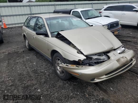1997 Saturn SW with VIN 1G8ZK827XVZ120119, listed as a Copart auction lot 57083245 with 199,971 mi miles and Salvage title. Bid and sale history available at DreamBid. Image 4.