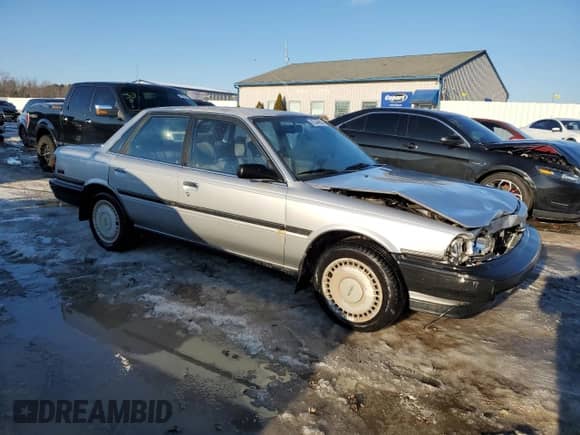 1990 Toyota Camry z VIN 4T1VV21EXLU008760, wystawiony jako Copart lot #88344665 z przebiegiem 154 971 mil mil oraz Nie do naprawy • Non repairable. Historia ofert i sprzedaży dostępna na DreamBid. Obrazek 4.