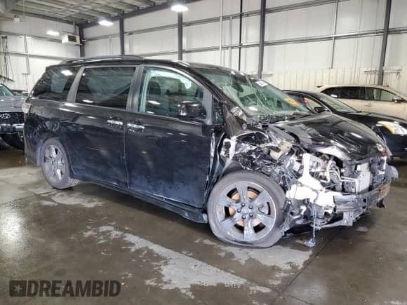 2014 Toyota Sienna SE with VIN 5TDXK3DC7ES482016, listed as a Copart auction lot 69857475 with 136,304 mi miles and Salvage title. Bid and sale history available at DreamBid. Image 4.