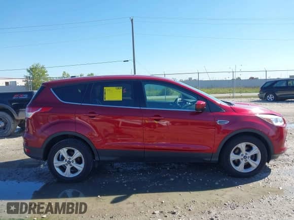 2014 Ford Escape SE z VIN 1FMCU0GX9EUA27858, wystawiony jako IAAI lot #43304775 z przebiegiem 151 878 mil mil oraz . Historia ofert i sprzedaży dostępna na DreamBid. Obrazek 13.