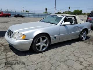 2000 Mercedes-Benz SL 500 with VIN WDBFA68F3YF189656, listed as a Copart auction lot 62521405 with 179,509 mi miles and Salvage title. Bid and sale history available at DreamBid. Image 1.