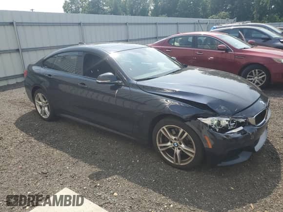 2015 BMW 4 Series 428i xDrive z VIN WBA4C9C58FD330455, wystawiony jako Copart lot #60933335 z przebiegiem 146 776 mil mil oraz Szkoda całkowita • Salvage title. Historia ofert i sprzedaży dostępna na DreamBid. Obrazek 4.