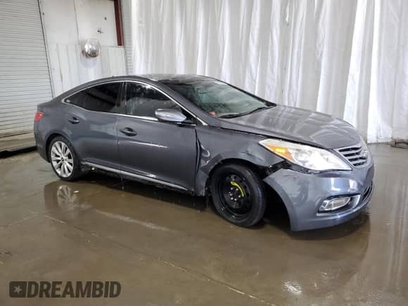 2013 Hyundai Azera z VIN KMHFH4JG2DA321197, wystawiony jako Copart lot #65585084 z przebiegiem 158 956 mil mil oraz Szkoda całkowita • Salvage title. Historia ofert i sprzedaży dostępna na DreamBid. Obrazek 4.