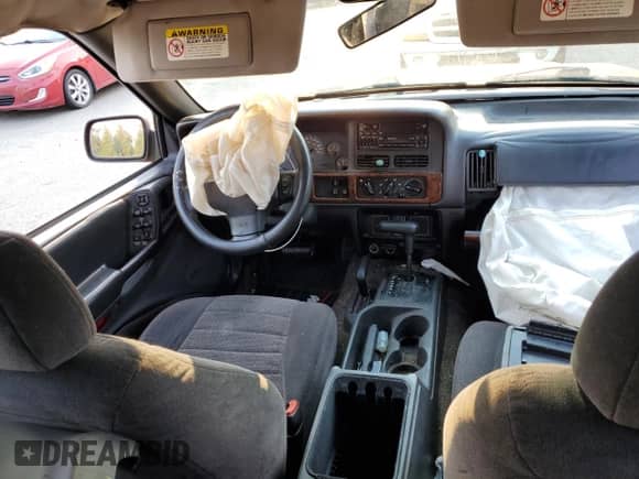 1996 Jeep Grand Cherokee с VIN 1J4EZ58Y5TC142263, выставлен на аукционе Copart как лот 70532894 с пробегом Не указан миль и Списание • Salvage title. История ставок и продаж доступна на DreamBid. Изображение 8.