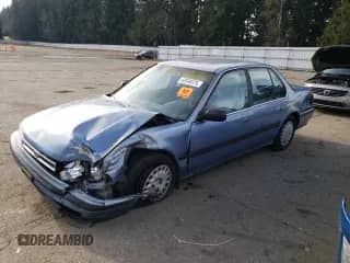 1990 Honda Accord LX with VIN JHMCB7657LC094933, listed as a Copart auction lot 42030575 with 156,426 mi miles and Salvage title. Bid and sale history available at DreamBid. Image 1.