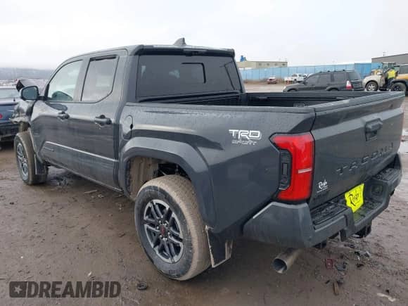 2024 Toyota Tacoma SR5 with VIN 3TMLB5JNXRM055645, listed as a IAAI auction lot 41208771 with 984 mi miles and . Bid and sale history available at DreamBid. Image 3.