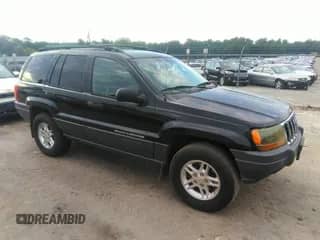 2003 Jeep Grand Cherokee Laredo z VIN 1J4GX48S53C543557, wystawiony jako IAAI lot #43123734 z przebiegiem 312 304 mil mil oraz . Historia ofert i sprzedaży dostępna na DreamBid. Obrazek 1.