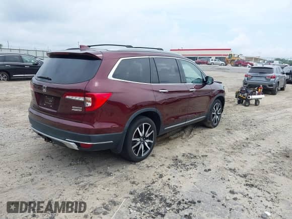 2021 Honda Pilot Touring 7-Passenger z VIN 5FNYF6H66MB062166, wystawiony jako IAAI lot #42550464 z przebiegiem 52 376 mil mil oraz . Historia ofert i sprzedaży dostępna na DreamBid. Obrazek 4.