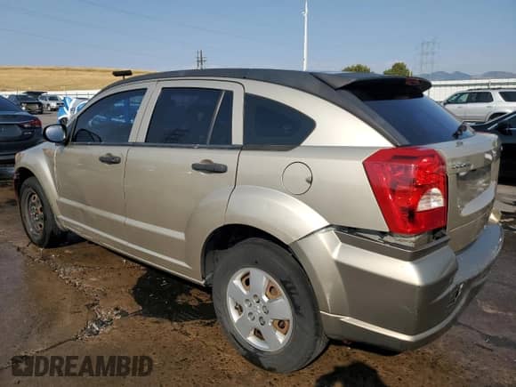 2009 Dodge Caliber SE with VIN 1B3HB28A99D151772, listed as a Copart auction lot 66681595 with 189,648 mi miles and Salvage title. Bid and sale history available at DreamBid. Image 2.