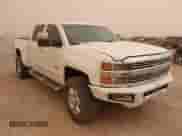 2016 Chevrolet Silverado 2500HD High Country z VIN 1GC1KXE80GF290043, wystawiony jako IAAI lot #41719644 z przebiegiem 122 715 mil mil oraz . Historia ofert i sprzedaży dostępna na DreamBid. Obrazek 1.