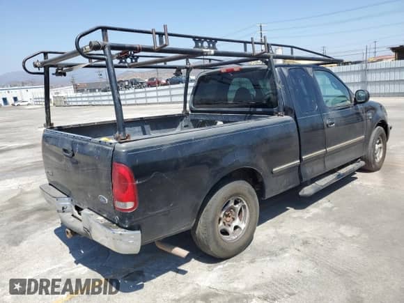 1998 Ford F-150 with VIN 1FTZX1763WKA58006, listed as a Copart auction lot 57264195 with 273,690 mi miles and Salvage title. Bid and sale history available at DreamBid. Image 3.