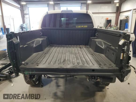 2023 Toyota Tacoma SR5 with VIN 3TYAZ5CN2PT042244, listed as a Copart auction lot 76022534 with 9,551 mi miles and Salvage title. Bid and sale history available at DreamBid. Image 6.
