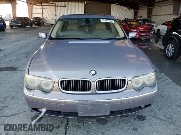 2004 BMW 7 Series 745Li with VIN WBAGN63404DS45720, listed as a Copart auction lot 82421485 with 173,177 mi miles and Salvage title. Bid and sale history available at DreamBid. Image 5.