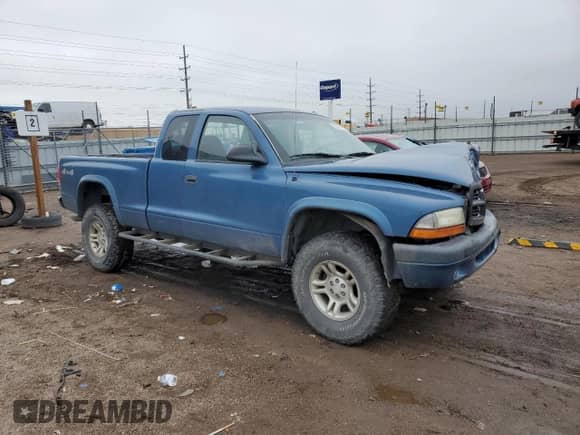 2004 Dodge Dakota Sport with VIN 1D7HG32N94S729963, listed as a Copart auction lot 59885725 with 157,911 mi miles and Salvage title. Bid and sale history available at DreamBid. Image 4.