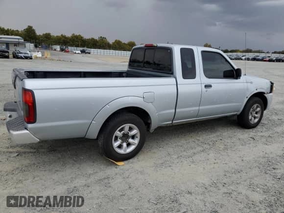 2002 Nissan Frontier XE with VIN 1N6DD26S42C319636, listed as a Copart auction lot 86513805 with 172,562 mi miles and Salvage title. Bid and sale history available at DreamBid. Image 3.