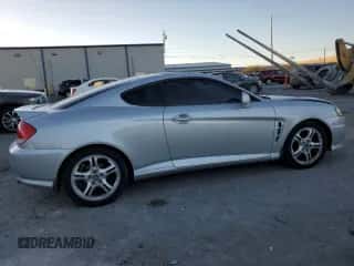 2005 Hyundai Tiburon GT с VIN KMHHN65F05U171038, выставлен на аукционе Copart как лот 87765735 с пробегом 113 129 миль миль и Списание • Salvage title. История ставок и продаж доступна на DreamBid. Изображение 3.