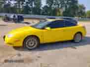 2001 Saturn SC with VIN 1G8ZY12771Z320035, listed as a Copart auction lot 80707645 with 149,680 mi miles and Salvage title. Bid and sale history available at DreamBid. Image 1.