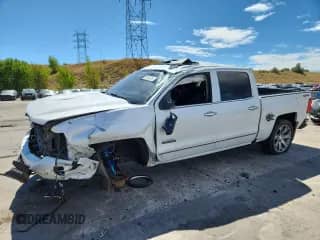 2018 Chevrolet Silverado 1500 High Country with VIN 3GCUKTEJ2JG314387, listed as a Copart auction lot 70758535 with 137,703 mi miles and Salvage title. Bid and sale history available at DreamBid. Image 1.