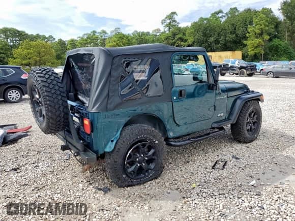 1999 Jeep Wrangler Sport with VIN 1J4FY19S7XP435204, listed as a Copart auction lot 83820835 with 263,738 mi miles and Clean title. Bid and sale history available at DreamBid. Image 3.