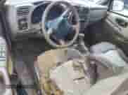 1999 Chevrolet Blazer LS z VIN 1GNCS13W0X2133425, wystawiony jako Copart lot #81930324 z przebiegiem 224 669 mil mil oraz Szkoda całkowita • Salvage title. Historia ofert i sprzedaży dostępna na DreamBid. Obrazek 8.