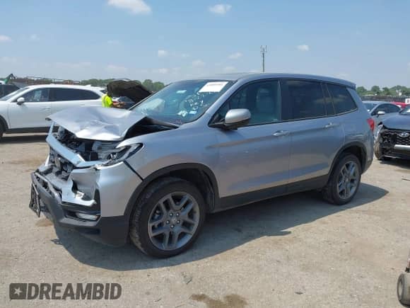2022 Honda Passport EX-L with VIN 5FNYF8H56NB030824, listed as a IAAI auction lot 43089301 with 16,999 mi miles and . Bid and sale history available at DreamBid. Image 2.
