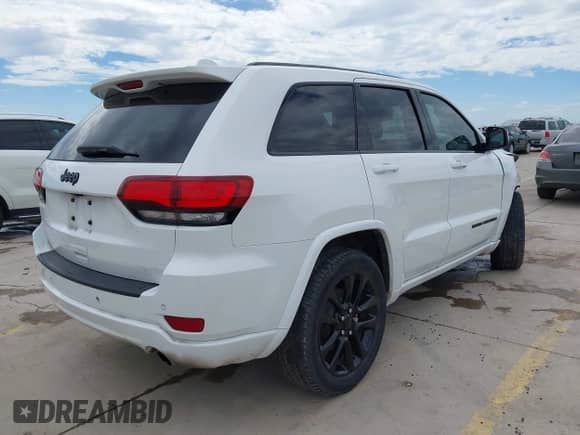 2020 Jeep Grand Cherokee Laredo E with VIN 1C4RJEAG9LC306226, listed as a IAAI auction lot 42839164 with 139,980 mi miles and . Bid and sale history available at DreamBid. Image 4.
