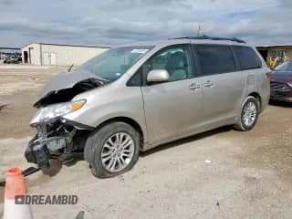 2015 Toyota Sienna XLE with VIN 5TDYK3DC7FS643776, listed as a Copart auction lot 83765695 with 192,116 mi miles and Salvage title. Bid and sale history available at DreamBid. Image 1.