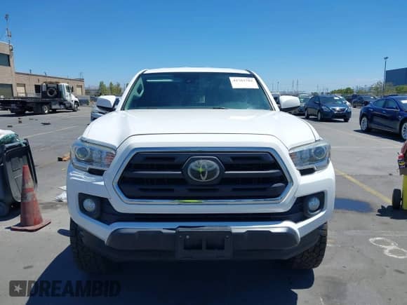 2018 Toyota Tacoma SR5 z VIN 5TFSZ5AN7JX125771, wystawiony jako IAAI lot #42783782 z przebiegiem 152 340 mil mil oraz . Historia ofert i sprzedaży dostępna na DreamBid. Obrazek 12.